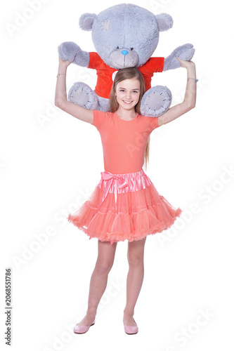 Happy little girl with toy bear