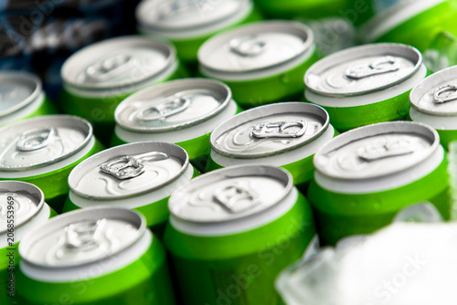 Photography High angle view of unbranded green aluminum cans chilling in ice