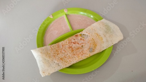 Traditional Masala Dosa Served with Curry Sauce