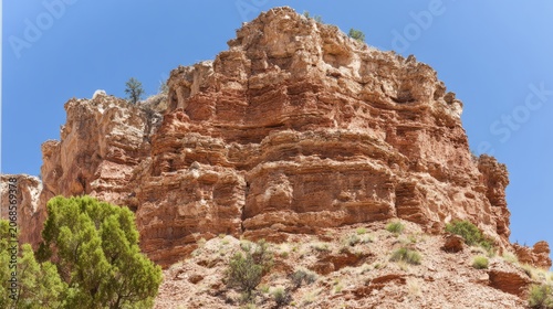 tonalite. Stepped rock layers in a canyon wall, desert landscape. travel magazines, destination branding, wall prints, designed for outdoor magazines and nature guides, used by graphic designers.
