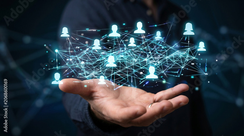 Minimalist conceptual illustration of a hand holding a digital communication network with floating profile silhouettes, people connecting online in an abstract web grid to create a virtual community