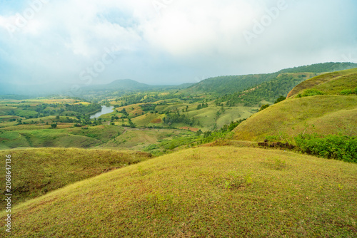 Rolling Hills Landscape with Green Vegetation and Cloudy Sky in Banswara, Udaipur, Rajasthan