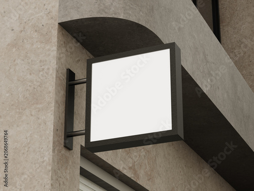 Bild auf Leinwand Blank black square signboard mockup mounted on a modern beige stone building fac