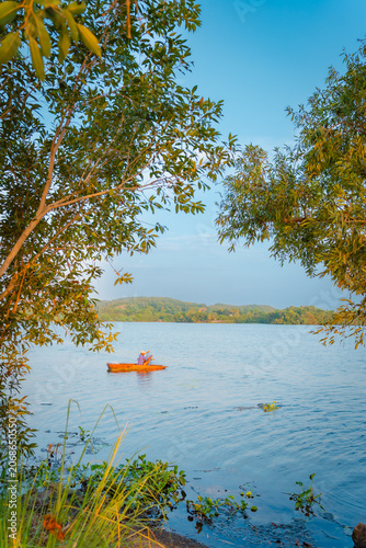 Cuadro en lienzo Aerial View of a Man Rowing a Traditional Canoe (“Catraia”) Transporting Passeng