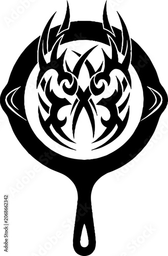 Cast iron skillet with tribal flame design