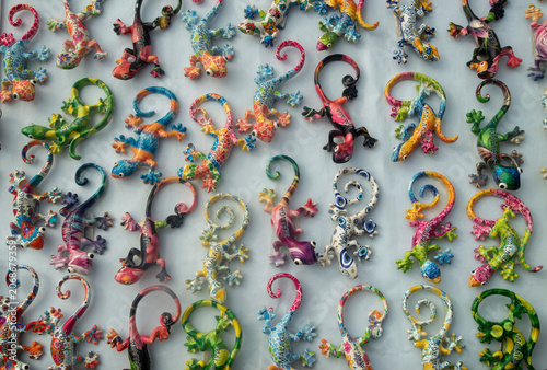 Colorful mosaic lizard souvenirs. Traditional Málaga salamander wall decorations