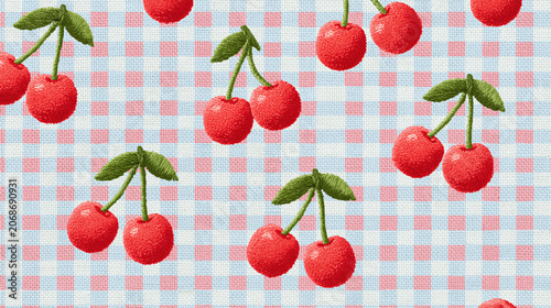 Red cherry embroidery on blue and pink checkered fabric with green leaves