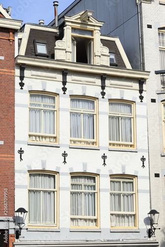 Amsterdam Prinsengracht Canal Building White Facade with Pale Yellow Window Frames Close Up, Netherlands
