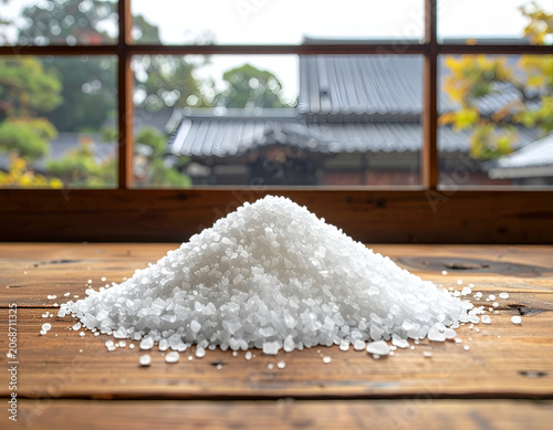 A Pile of Coarse Salt Crystals on a Wooden Surface with a Japanese Window View.
