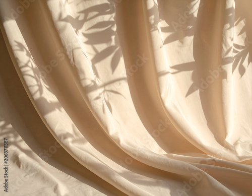 Soft Fabric Drapes with Natural Leaf Shadow Patterns.
