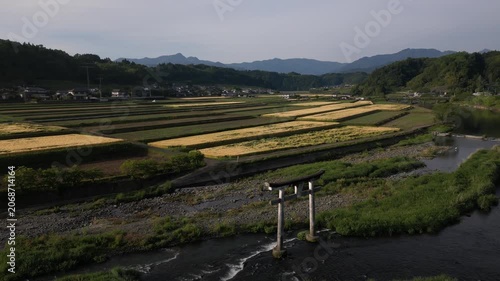 conic Torii Gate Overlooking Harajiri Falls, Aerial Drone View, Oita Japan