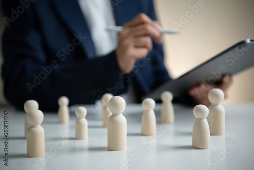 Bild auf Leinwand Human resources management concept with wooden figures and HR professional analy