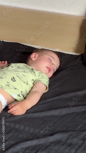 Sleeping baby on a bed 