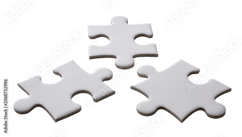 Cuadro en lienzo Three white puzzle pieces scattered