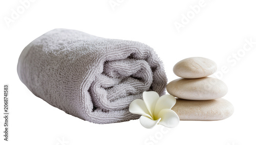 Canvas Print Rolled gray towel with stacked spa stones and white flower