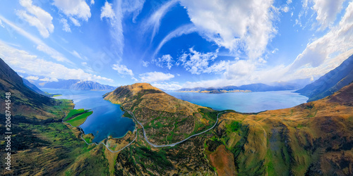 Aerial panoramic view of the mountain roads between lakes in Wanaka, New Zealand