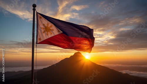 Philippine Flag Waving at Sunrise Over Mountain Peak