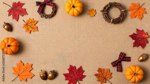 Autumn thanksgiving frame with pumpkins acorns and colorful maple leaves