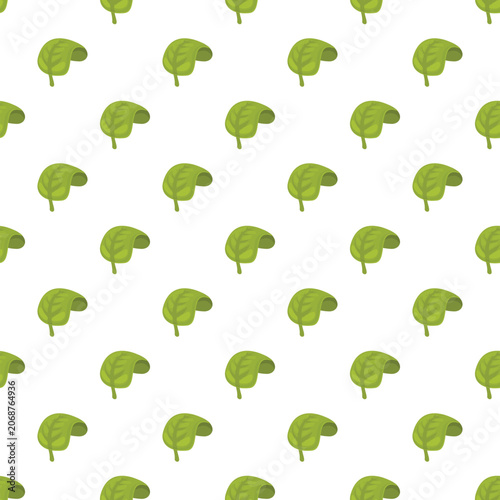 Green spinach leaves creating a seamless repeating pattern on a white background