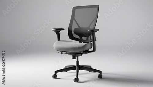 Chair with a mesh back stands in the center of a clean studio space against a light gray background.