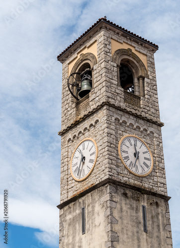 View of the bell tower of Santa Maria Assunta Church in Porto Valtravaglia, a charming village on the shores of Lake Maggiore in Lombardy, Italy