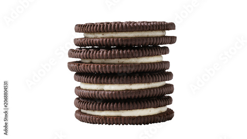 Stack of dark chocolate sandwich cookies with cream filling, isolated on transparent background