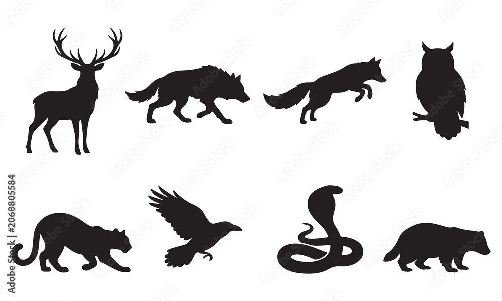 Obraz premium Set of black silhouettes of wild animals and birds including a stag, wolf, fox, owl, panther, raven, cobra, and badger isolated on a white background, for nature and wildlife