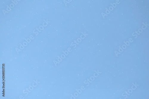 illustration of snowing against blue background