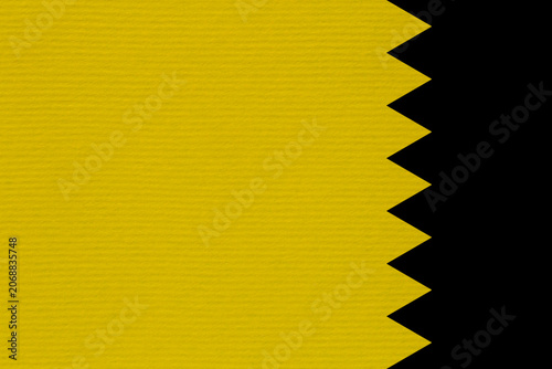 striped mustard cardboard against black zigzag band at right side