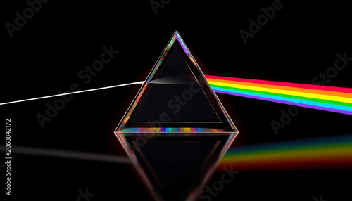 Prism refracts a single beam of white light into a vibrant spectrum of colors against a deep black background demonstrating the fundamental principles of optical physics and light dispersion.