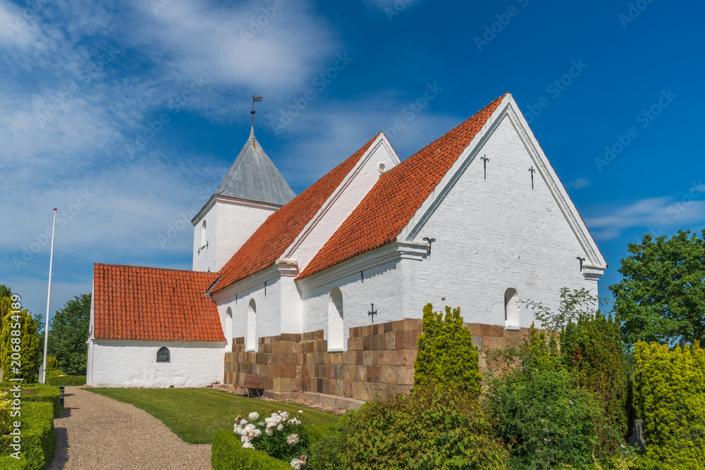 Fototapeta premium Traditional Danish Countryside Church with White Walls and Red Tile Roof