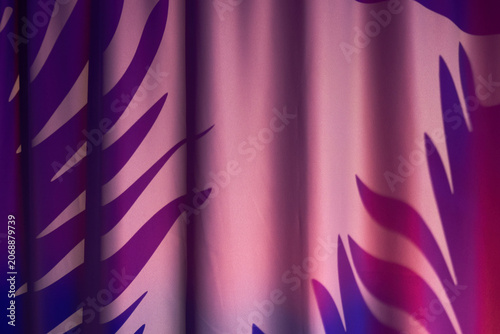 Dramatic theater stage backdrop. Vivid red and purple velvet curtain with motion effects and spotlight gradients creating striking atmosphere