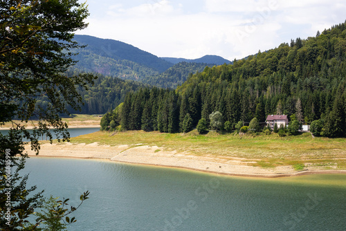 Фотография Scenic view of mountains and lake in the Transfagarasan area of Romania, perfect for travel, hiking and nature backgrounds