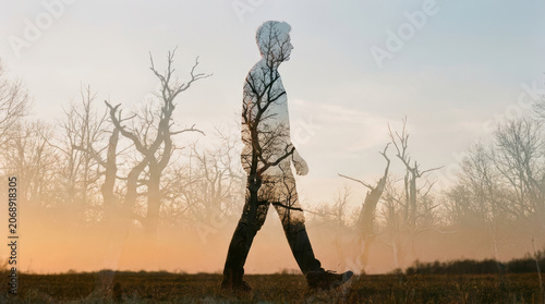 Man walking silhouette forest trees double exposure sunset nature landscape