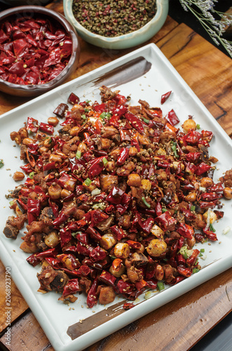 Spicy chicken served on a square celadon plate