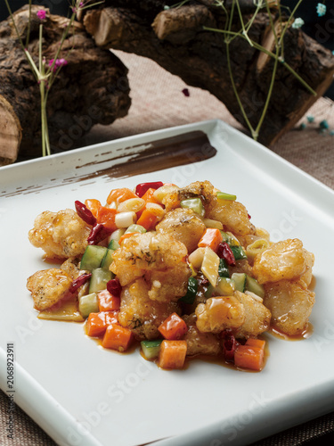 Kung Pao Cod served on a square celadon plate