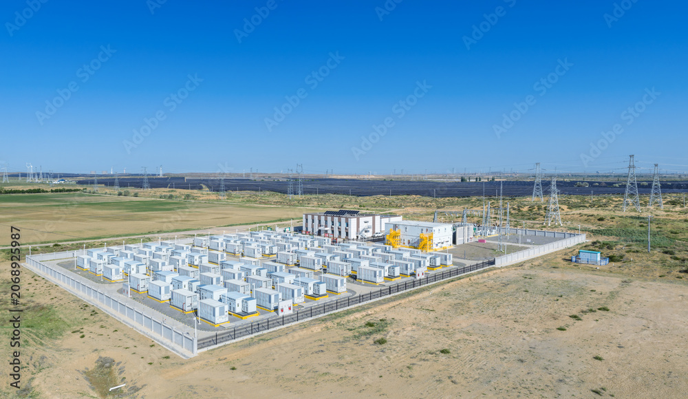 Fototapeta premium Aerial View of a Large-Scale Battery Energy Storage Power Station Next to Solar Farm
