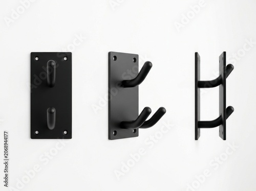Double prong wall hook set in matte black finish displayed at various angles on white surface for interior organization product marketing
