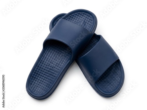 Navy blue rubber slide sandals resting on white background with sharp top-down studio lighting for footwear retail advertising