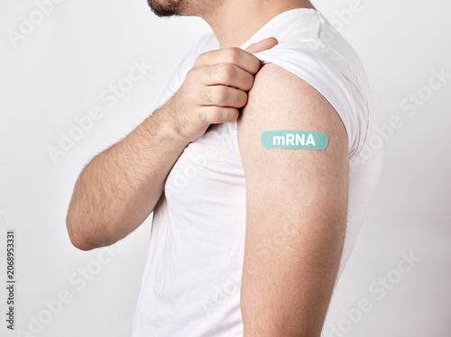Cuadro en lienzo Man showing mRNA bandage after vaccine injection