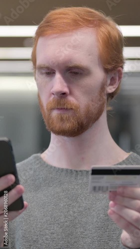Portrait of Young Man making Online Payment on Smartphone, , Vertical Video