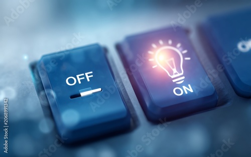 Close-up of illuminated on switch button with off button at side