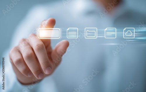 Business Professional Interacting with Digital File Management Icons on Transparent Holographic Display