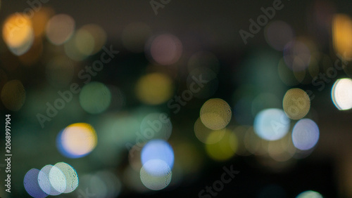 Valokuva Abstract blurred city lights creating a colorful bokeh effect at night