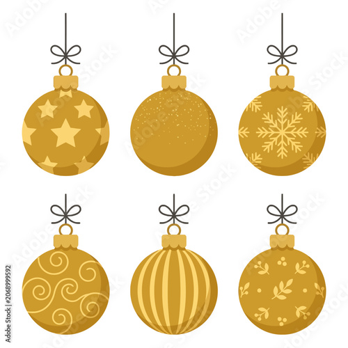 Fotografie Six golden Christmas baubles hang on a white background