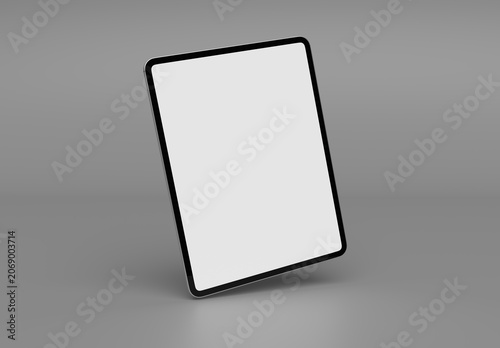 Modern tablet with shadow isolated and standing on clean grey background Mockup. Silver color. 3D rendering