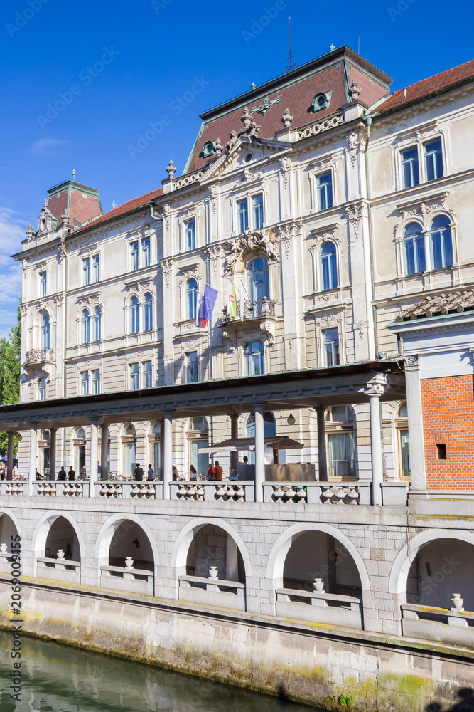 Fototapeta premium Historic Kresija Palace at the river in Ljubljana, Slovenia
