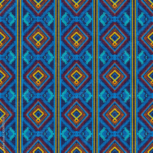 Vibrant Blue Ethnic Geometric Stripe Seamless Pattern with Tribal Diamond Embroidery Ornaments for Boho Chic Fashion Textile and Luxury Canvas Fabric Print