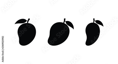 Fotografie Three black mango silhouettes with leaf stems against a plain white background s