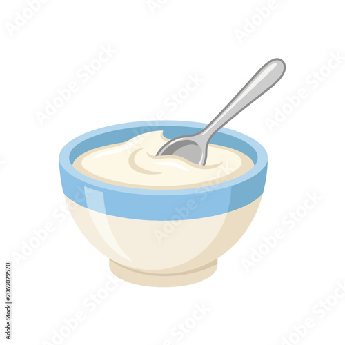 A bowl of fresh creamy yogurt with a silver spoon